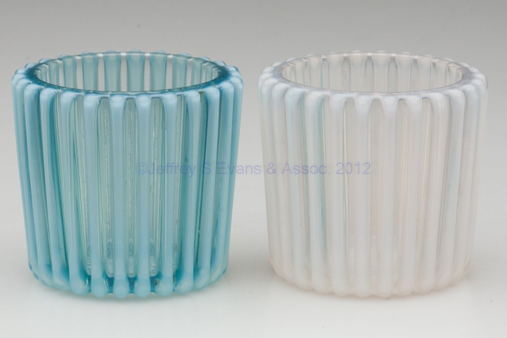 BEATTY RIB TOOTHPICK HOLDERS, LOT OF TWO: BEATTY RIB TOOTHPICK HOLDERS, LOT OF TWO, colorless and blue opalescent. Fourth quarter 19th century. 2" H.