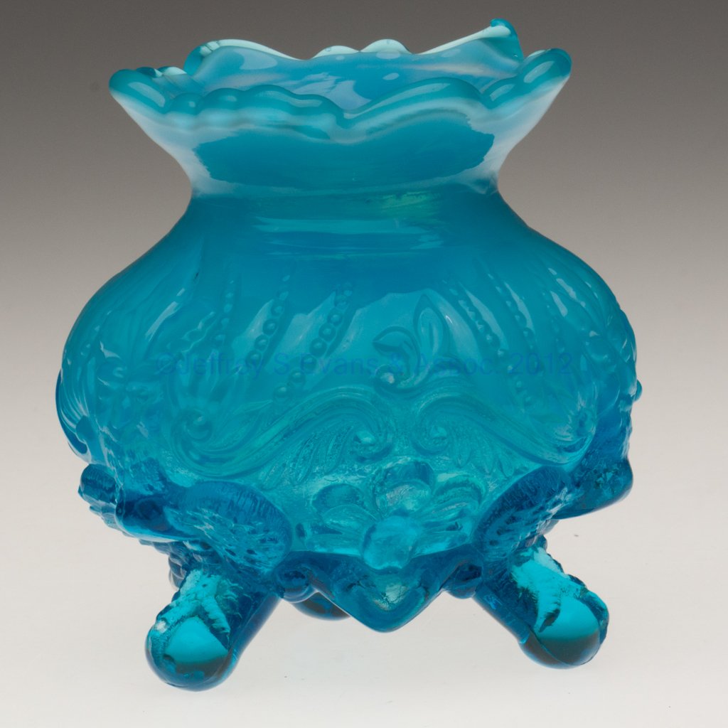 PIASA BIRD ROSE BOWL / LADY'S SPITTOON: PIASA BIRD ROSE BOWL / LADY'S SPITTOON, blue opalescent, raised on three feet. Late 19th/early 20th century. 4 1/2" H, 3 1/2" D rim. Literature: Parallels Heacock/Elmore - Opalescent Glass, fig. 524. 