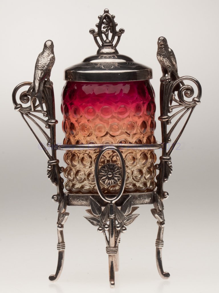 BLOWN-MOLDED HOBNAIL AMBERINA PICKLE CASTER: BLOWN-MOLDED HOBNAIL AMBERINA PICKLE CASTER, brilliant fuchsia to amber, jar base with 18 petals and a polished pontil mark, ornate Rogers Bro. #122 quadruple-plate stand with birds. Probably Mt. Wash