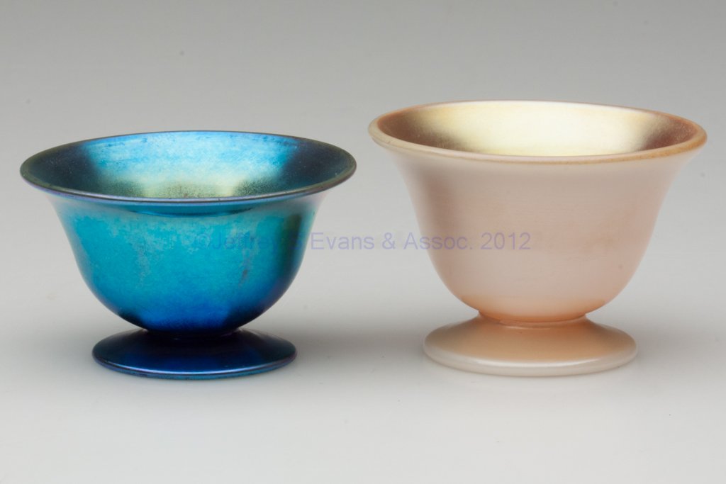 STEUBEN OPEN SALTS, LOT OF TWO: STEUBEN OPEN SALTS, LOT OF TWO, Blue Aurene and Gold Calcite, shape 3067, blue example with appropriate markings, gold example unmarked, each with polished pontil mark. First half 20th century. 1 1/2"