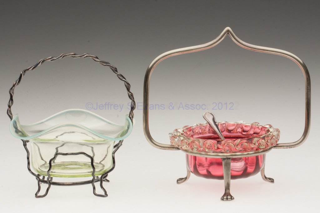 ASSORTED GLASS OPEN SALTS, LOT OF TWO: ASSORTED GLASS OPEN SALTS, LOT OF TWO, comprising a cranberry example with applied vaseline (uranium) rigaree, and a vaseline (uranium) opalescent example, each with polished pontil mark and basket-st