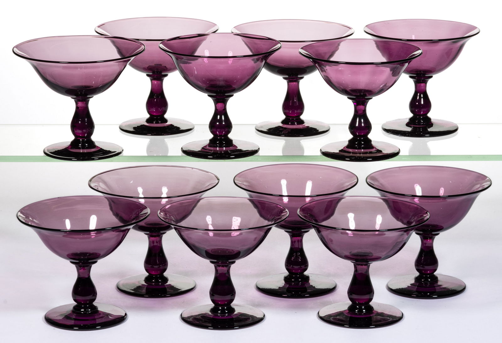 STEUBEN NO. 6192 ART GLASS SHERBETS, LOT OF 12: STEUBEN NO. 6192 ART GLASS SHERBETS, LOT OF 12, amethyst, polished pontil marks. Steuben Glass Works. Circa 1925. 3 5/8" to 3 3/4" H. Provenance: From a Maryland private collection.