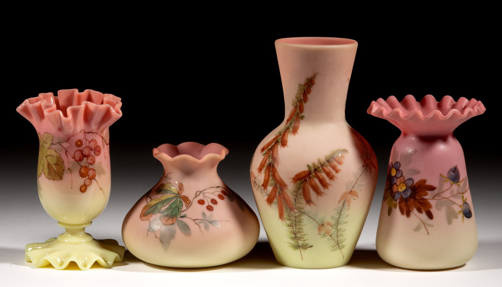 THOMAS WEBB DECORATED BURMESE ART GLASS ARTICLES, LOT OF FOUR: THOMAS WEBB DECORATED BURMESE ART GLASS ARTICLES, LOT OF FOUR, glossy and plush with polychrome-enamel decoration, comprising a squat and tapered vase with berry decoration, a footless example with a