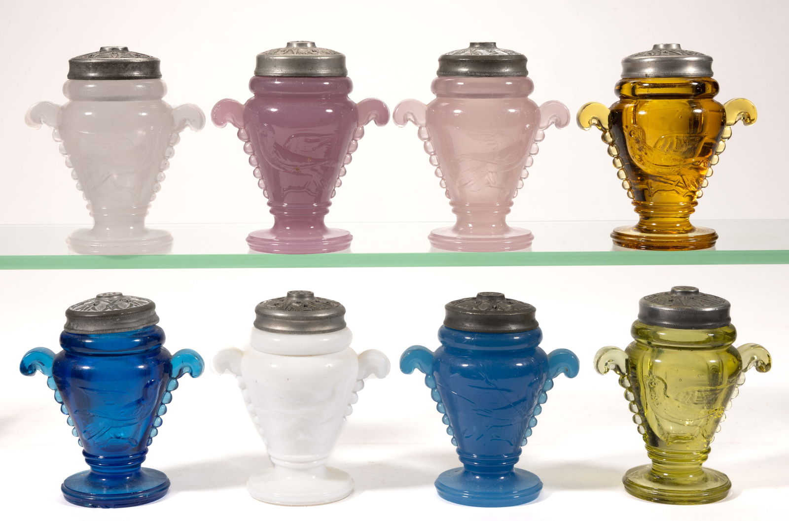 ASSORTED BIRD HANDLED SALT AND PEPPER SHAKERS, LOT OF EIGHT: ASSORTED BIRD HANDLED SALT AND PEPPER SHAKERS, LOT OF EIGHT, various colors comprising of amber, alabaster/clambroth, sapphire blue, opaque blue, translucent lavender, opaque lavender, yellow-gre