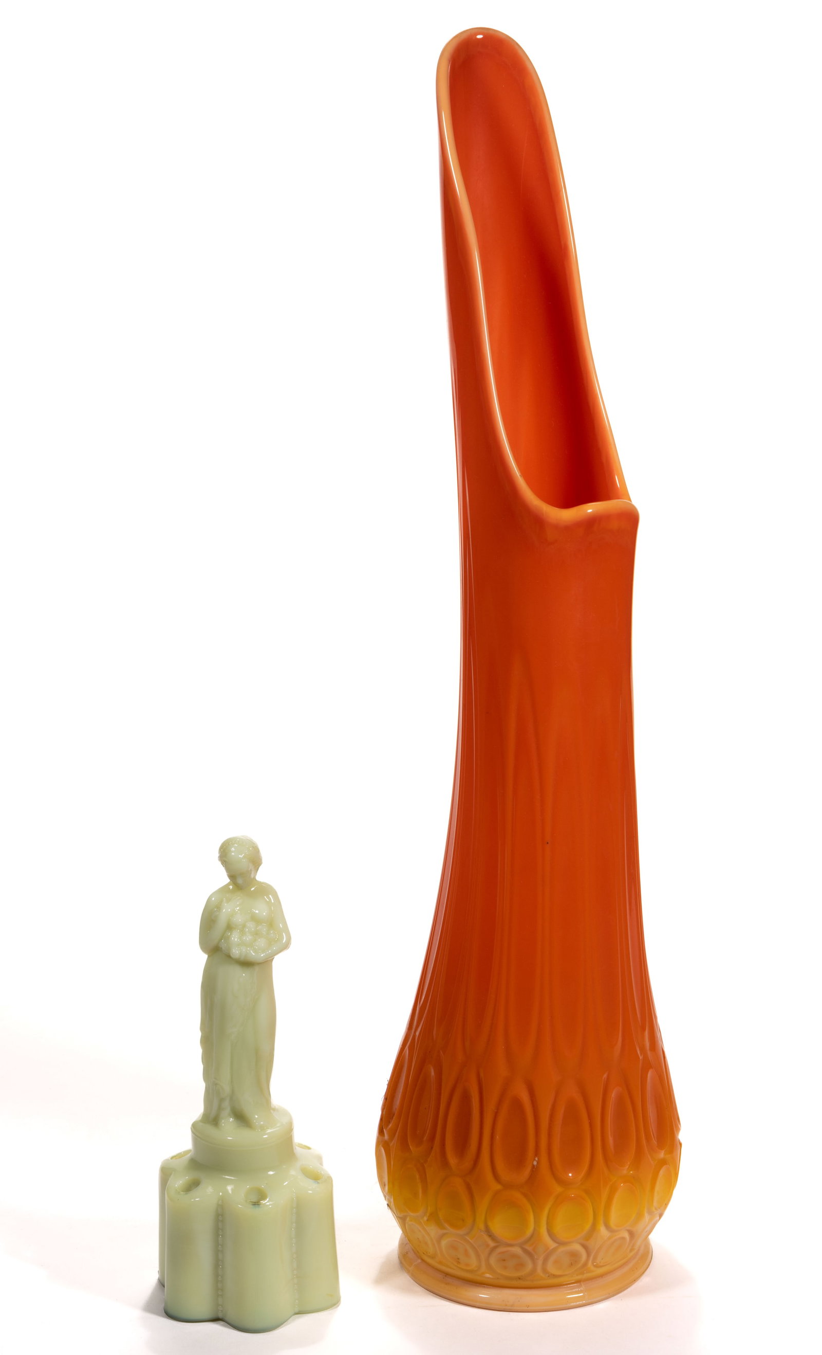 CAMBRIDGE ROSE LADY FLOWER FROG: CAMBRIDGE ROSE LADY FLOWER FROG, ivory/custard (reacts under black light), on a tall scalloped base. Together with a Mid-Century Modern bright orange slag swung vase with embossed ovals surrounding th