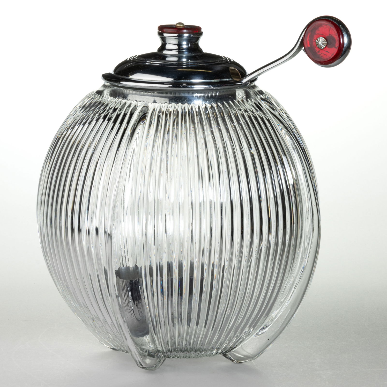 ART DECO GLASS AND CHROME PUNCH BOWL: ART DECO GLASS AND CHROME PUNCH BOWL, colorless, globular form with vertical ribs and factory polished rim, original chrome cover and ladle, both with red Bakelite/plastic mounts. Circa 1930. 10 1/4&q