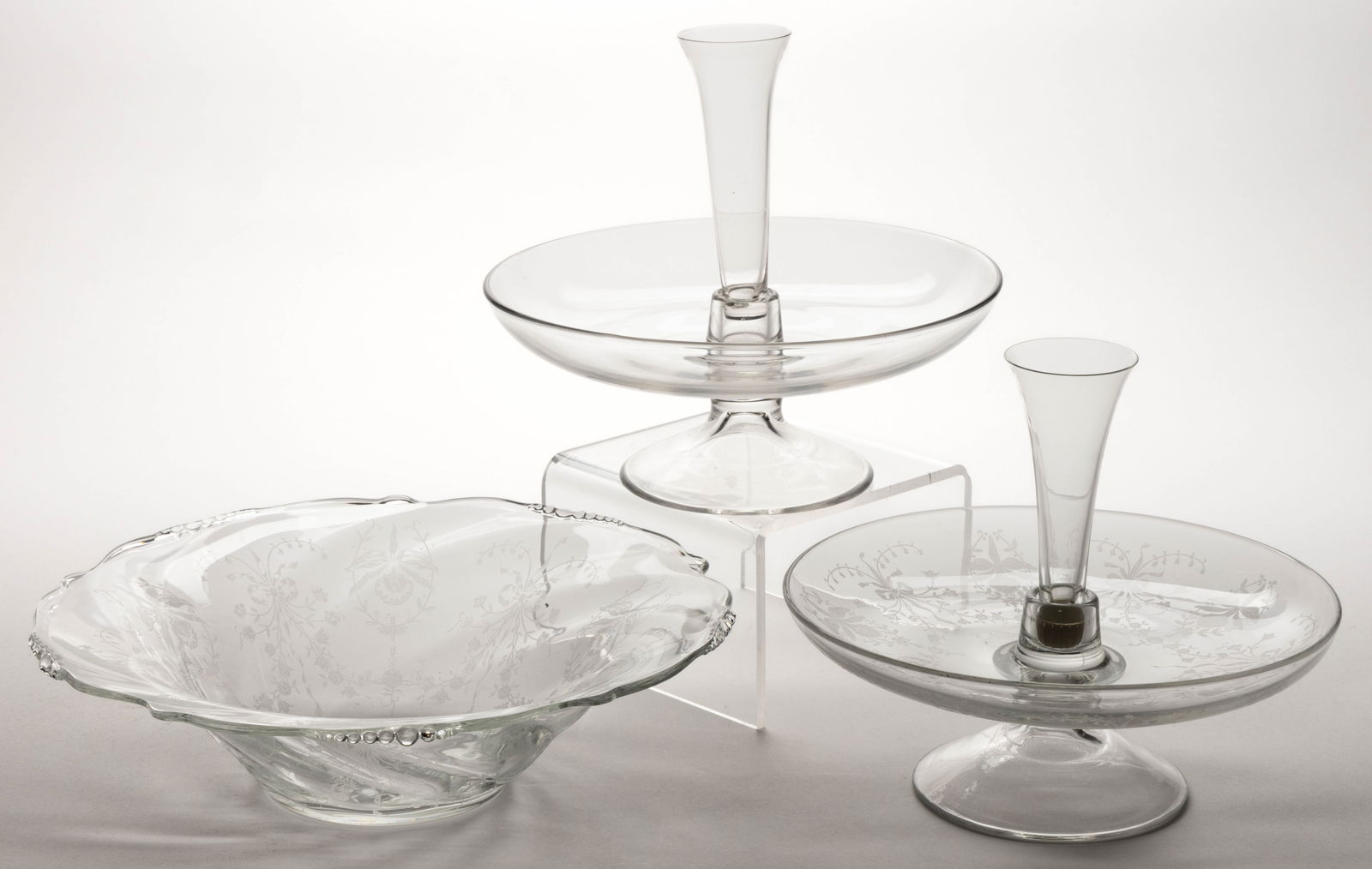 ASSORTED HEISEY PRESSED GLASS BOWLS / EPERGNES, LOT OF THREE: ASSORTED HEISEY PRESSED GLASS BOWLS / EPERGNES, LOT OF THREE, comprising a no. 1519 / Waverly bowl with orchid etch; and two No. 1187 / Yeoman epergne candleholders both with no. 1183 Revere inserts,