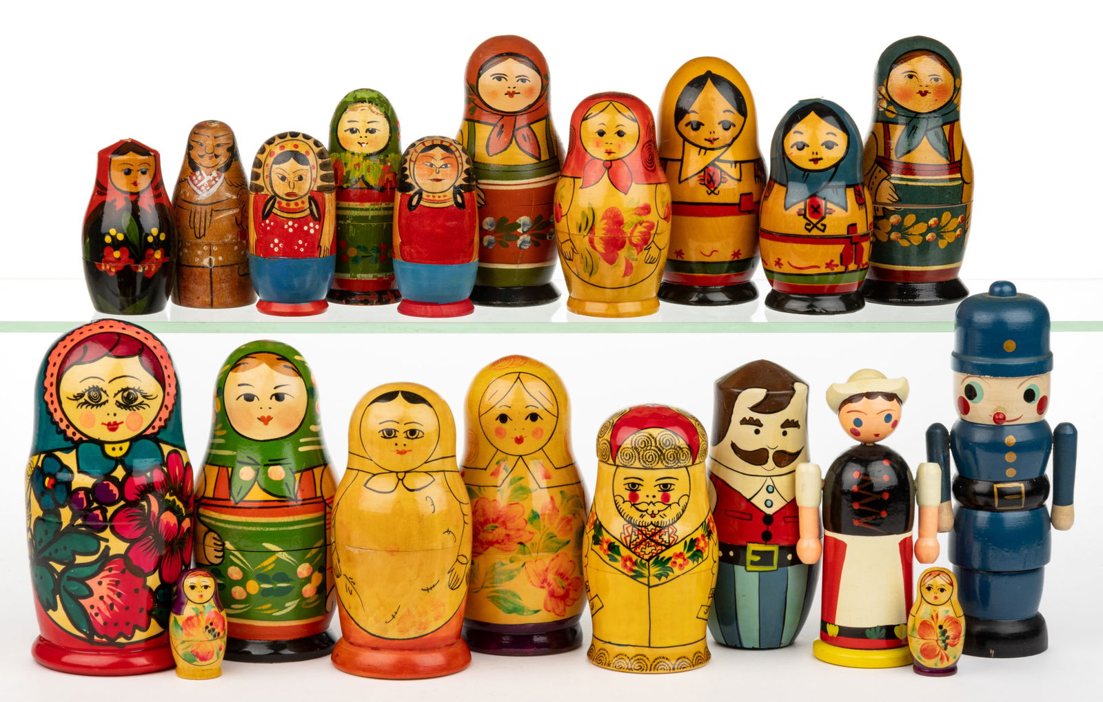 ASSORTED RUSSIAN NESTING DOLLS, LOT OF 20: ASSORTED RUSSIAN NESTING DOLLS, LOT OF 20, including many examples in various forms and styles. Mostly Russian or USSR, some marked Japan. 20th century. Tallest 6 1/2" HOA. Provenance: Collectio