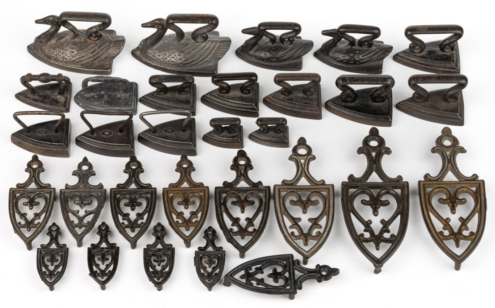 ASSORTED CAST-IRON AND OTHER MINIATURE SAD IRONS AND TRIVETS, LOT OF 30 (1 of 1)