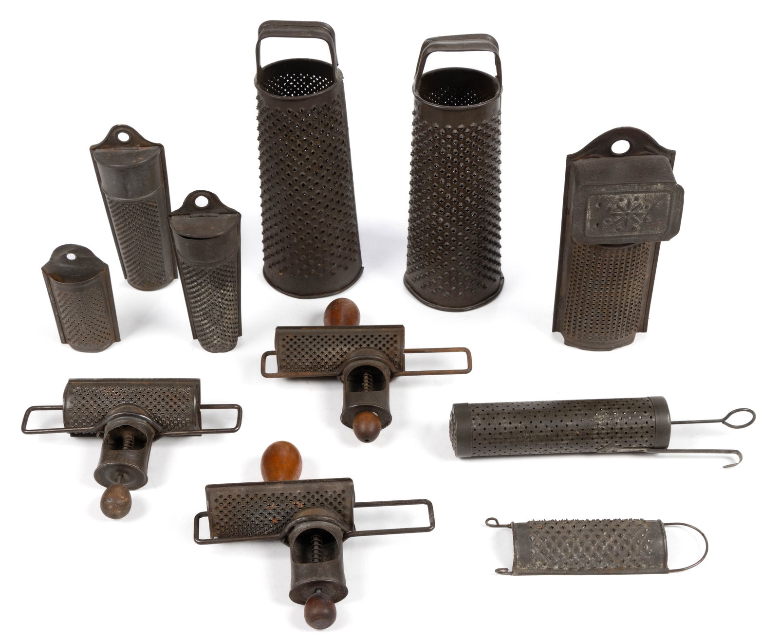 ASSORTED SHEET-IRON / TIN NUTMEG AND SPICES GRATERS, LOT OF NINE: ASSORTED SHEET-IRON / TIN NUTMEG AND SPICES GRATERS, LOT OF 11, comprising three Edgar examples with spring-activated and sliding hopper; five flat-sided examples, including one with a sliding do