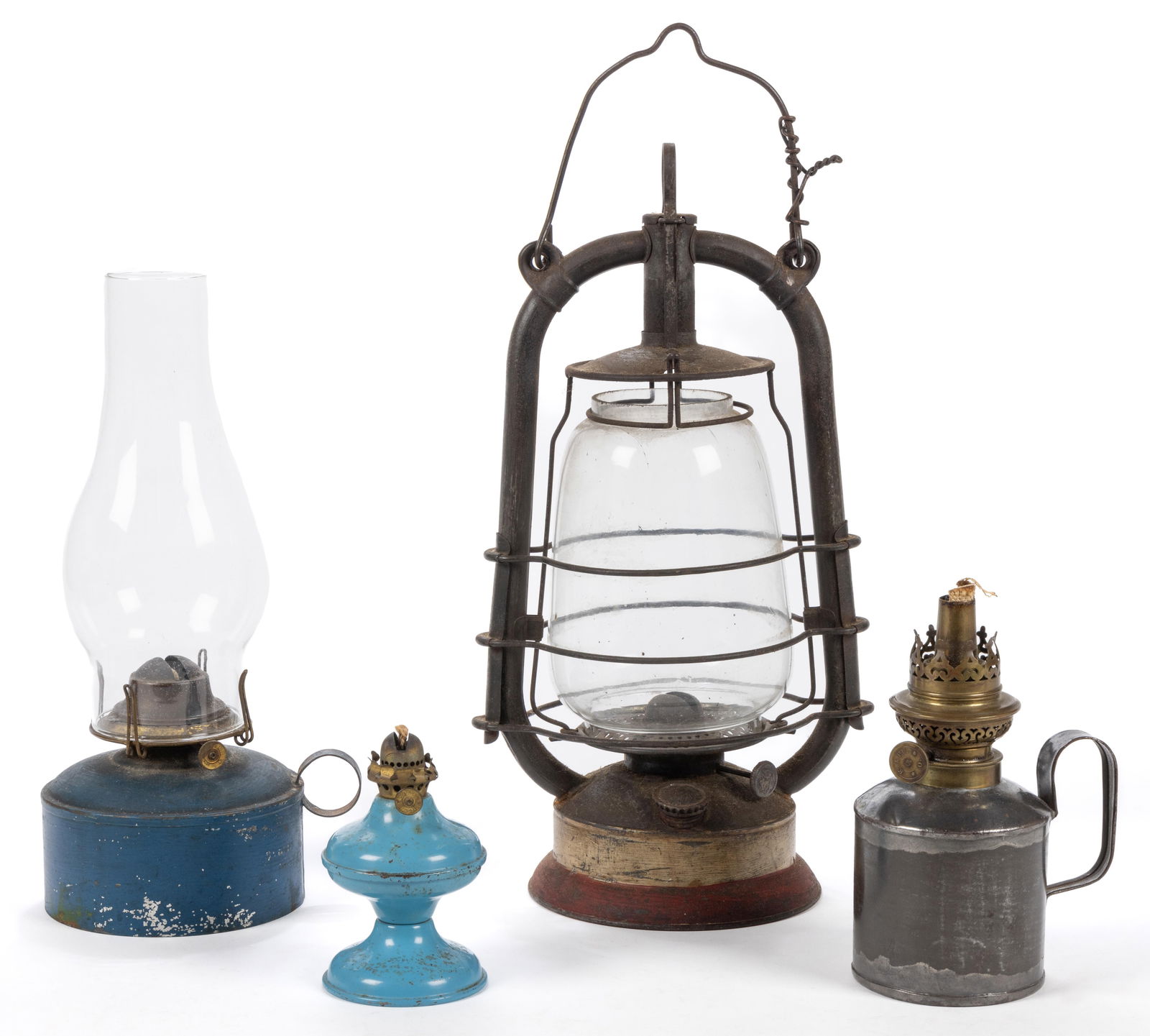 ASSORTED SHEET-IRON/TIN KEROSENE LAMPS AND LANTERNS, LOT OF FOUR: ASSORTED SHEET-IRON/TIN KEROSENE LAMPS AND LANTERNS, LOT OF FOUR, comprising a German Feuerhand No. 305 hot blast lantern, having a bail handle, base embossed with manufacturer and no., along with red