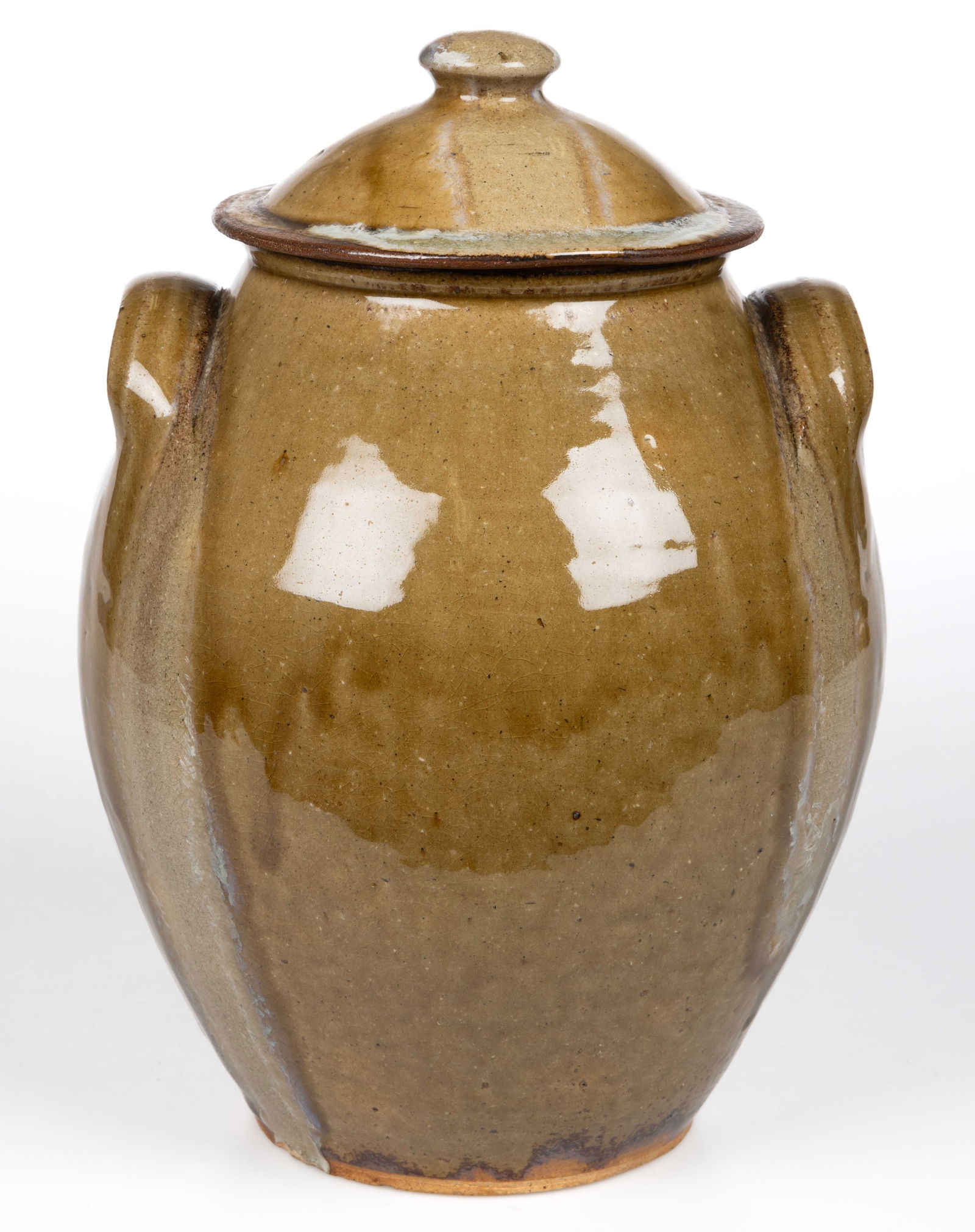 MARK HEWITT (BRITISH/AMERICAN, B.1955), NORTH CAROLINA STONEWARE COVERED JAR: MARK HEWITT (BRITISH/AMERICAN, B.1955), NORTH CAROLINA STONEWARE COVERED JAR, alkaline glaze with light rutile drips across handles and top of cover, ovoid form with applied arched handles. Stamp