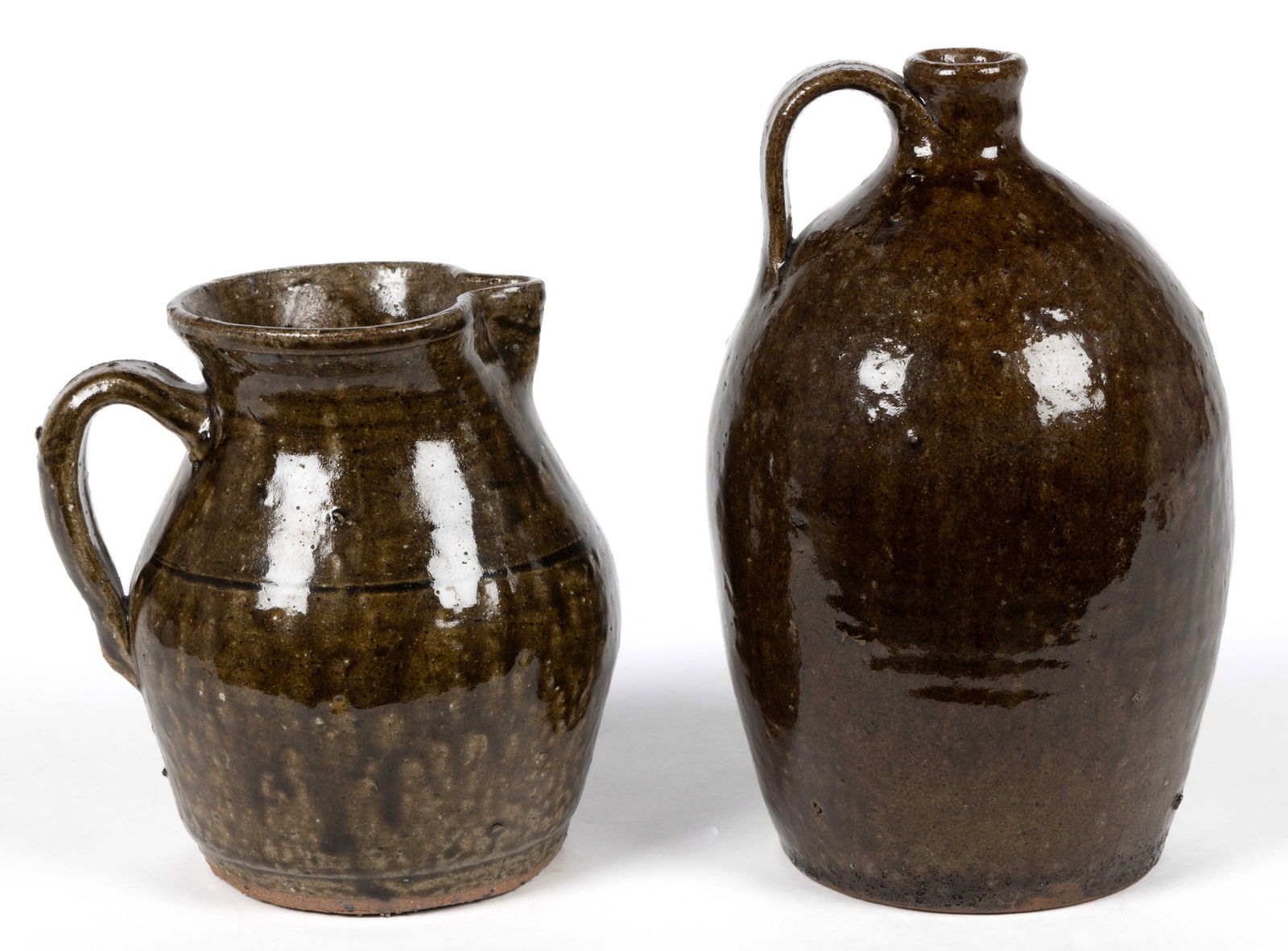 SIGNED "LANIER MEADERS" (1917-1998), WHITE CO., GEORGIA STONEWARE PITCHER: SIGNED "LANIER MEADERS" (1917-1998), WHITE CO., GEORGIA STONEWARE PITCHER, alkaline-glazed, approximately one-and-a-half quart capacity, ovoid form with rounded rim, incised shoulder ring, a