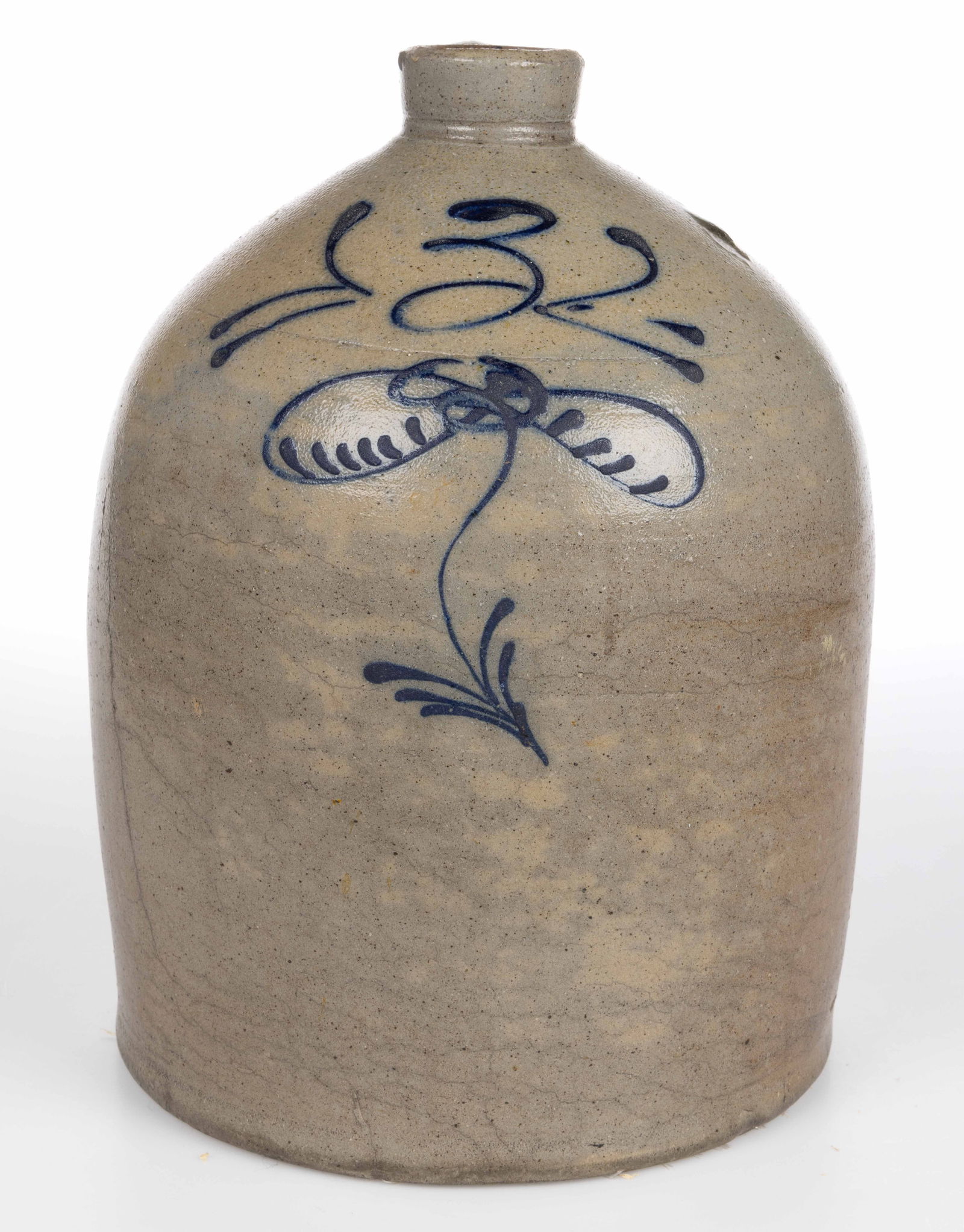 MIDWESTERN DECORATED STONEWARE JUG: MIDWESTERN DECORATED STONEWARE JUG, salt-glazed, designated three-gallon capacity, beehive form with ringed mouth and applied strap handle, Albany-slip glazed interior. Slip-trailed cobalt bee sting f