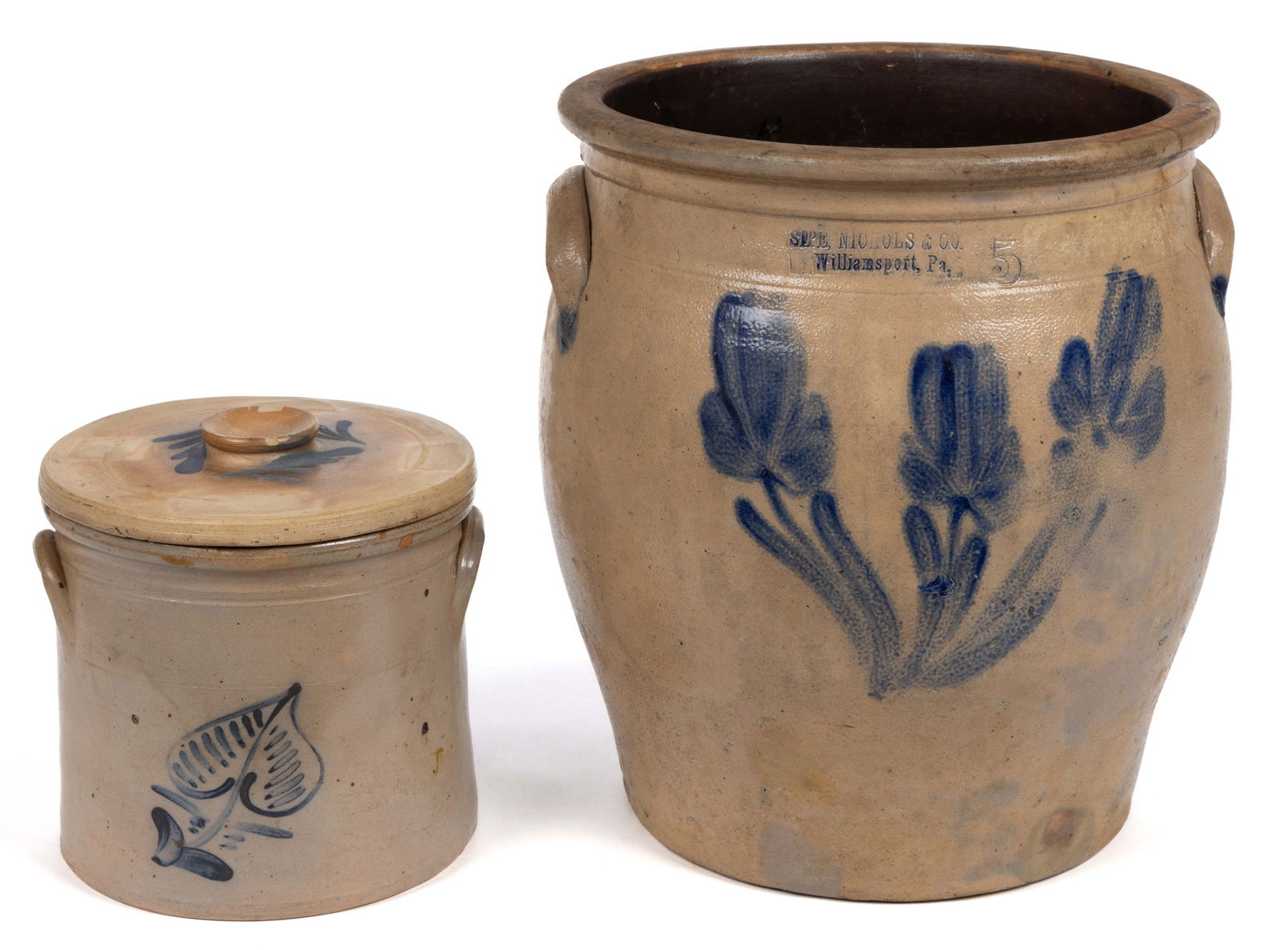 NORTHEASTERN DECORATED STONEWARE CROCKS, LOT OF TWO: NORTHEASTERN DECORATED STONEWARE CROCKS, LOT OF TWO, salt-glazed, each of wide-mouth form with applied arched handles, and Albany-slip glazed interior, comprising a stamped "SIPE, NICHOLS &a