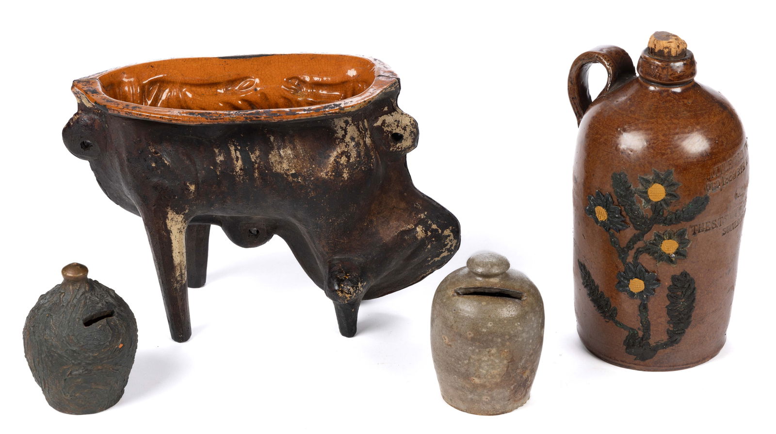 ASSORTED REDWARE AND STONEWARE ARTICLES, LOT OF FOUR: ASSORTED REDWARE AND STONEWARE ARTICLES, LOT OF FOUR, comprising two semi-ovoid form banks including one with textured surface and copper paint and one salt-glazed, one redware jug stamped &