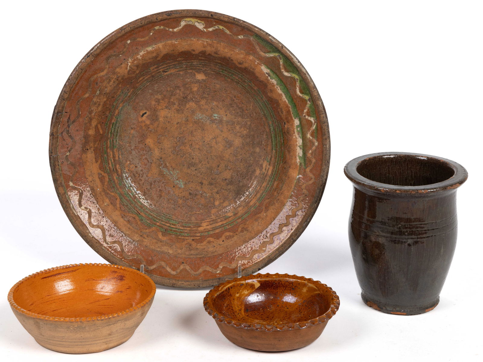 AMERICAN EARTHENWARE / REDWARE ARTICLES, LOT OF FOUR: AMERICAN EARTHENWARE / REDWARE ARTICLES, LOT OF FOUR, comprising a jar with flat rim and triple-incised shoulder rings and three lead-glazed examples including one 10 1/2" D dish/plate with yello