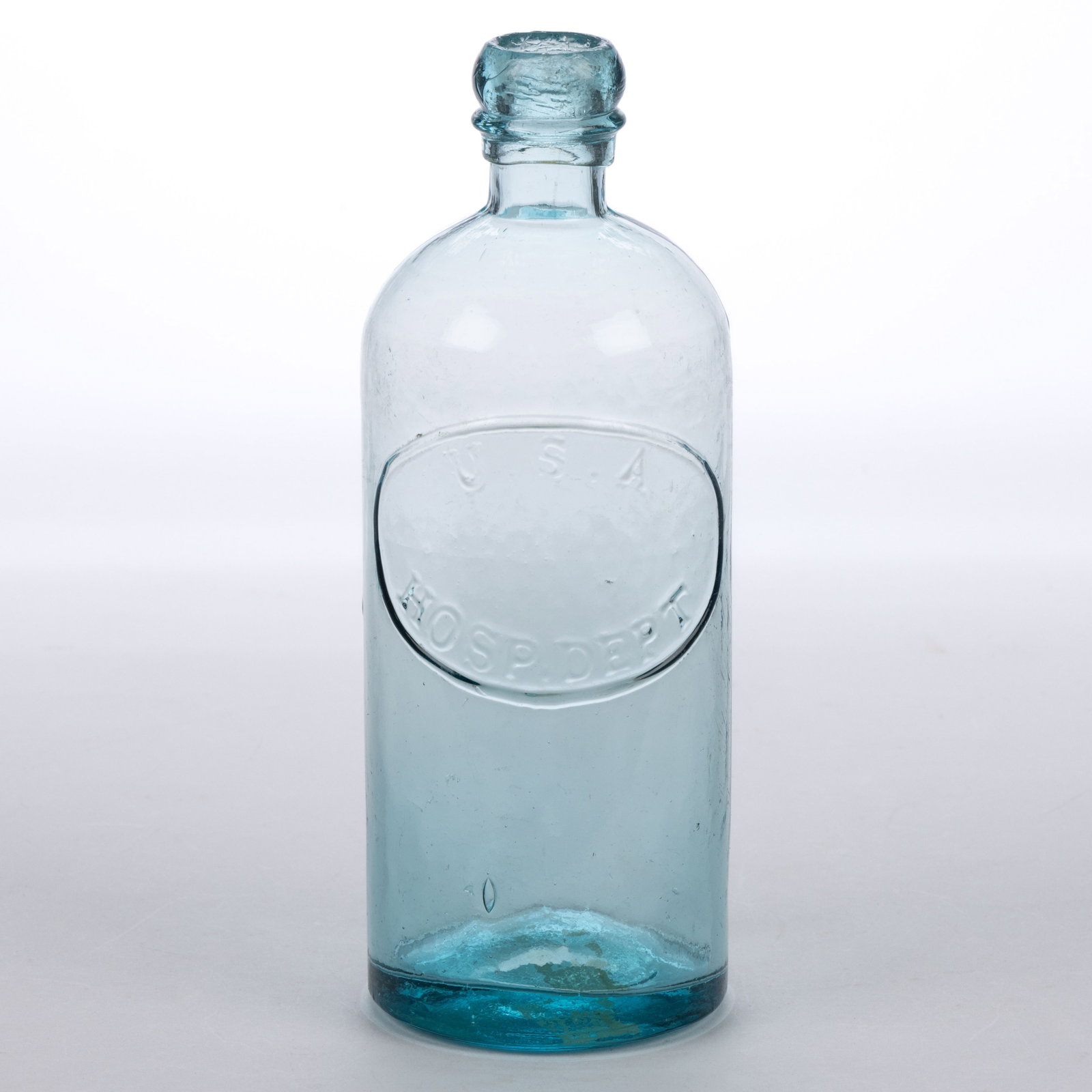 U.S.A. HOSPITAL DEPARTMENT CIVIL WAR MEDICINE BOTTLE: U.S.A. HOSPITAL DEPARTMENT CIVIL WAR MEDICINE BOTTLE, ice blue/aquamarine, smaller "pint" size cylindrical form blown in a three-piece mold and embossed "U.S.A. / HOSP. DEPT&q