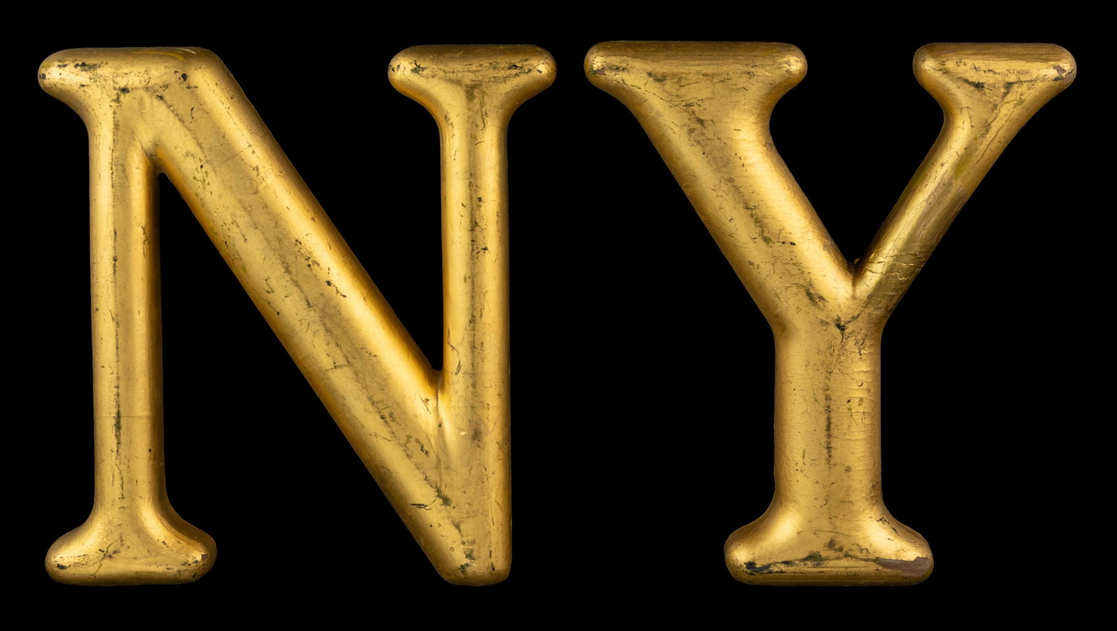 AMERICAN FOLK ART WOODEN TRADE SIGN LETTERS, LOT OF TWO: AMERICAN FOLK ART WOODEN TRADE SIGN LETTERS, LOT OF TWO, "N" and "Y", each retaining likely original gilt surface. Late 19th/first quarter 20th century. Each 9" HOA.