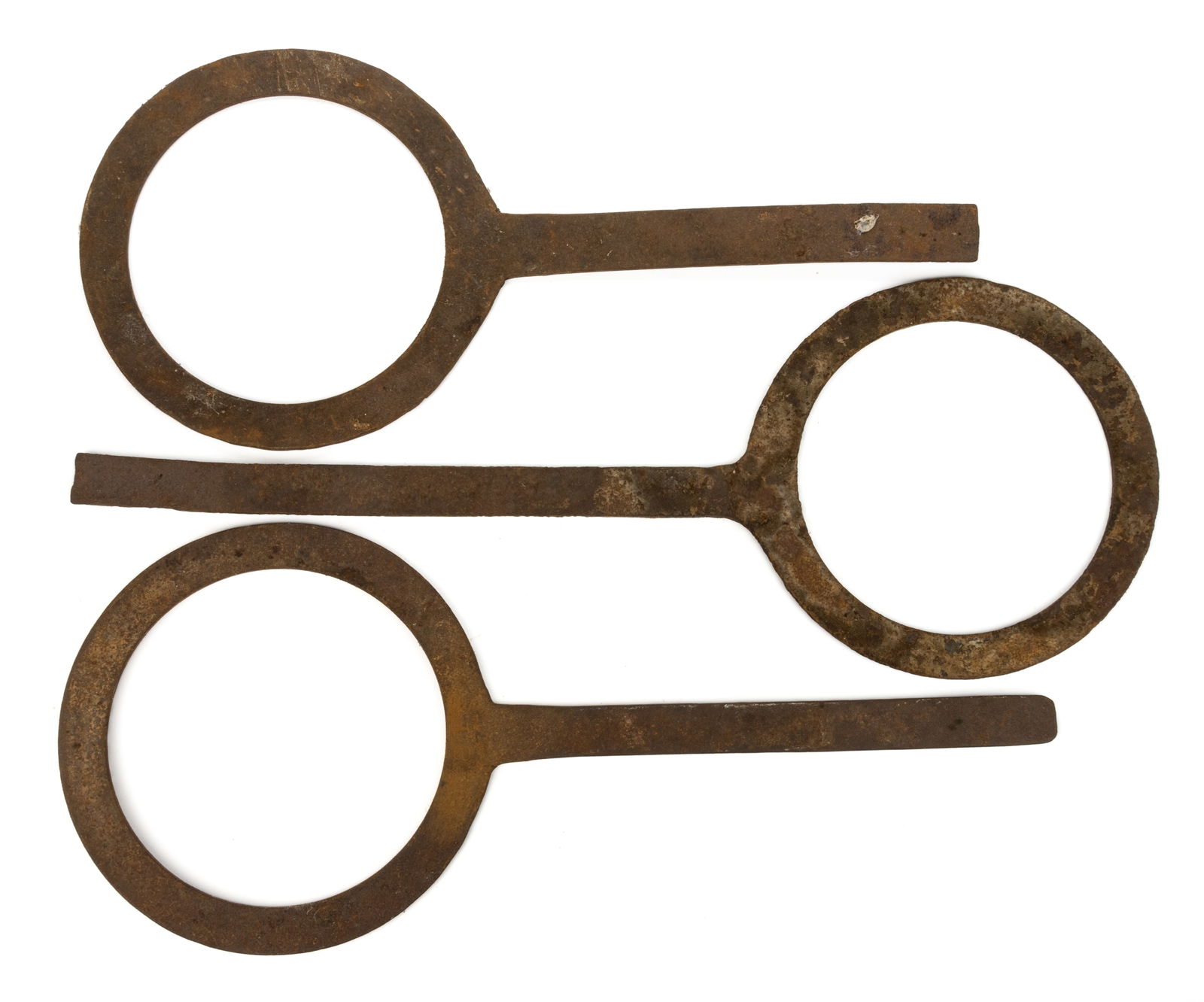 CIVIL WAR ERA WROUGHT-IRON ARTILLERY SIZING GAUGES / RINGS, LOT OF THREE: CIVIL WAR ERA WROUGHT-IRON ARTILLERY SIZING GAUGES / RINGS, LOT OF THREE, each with an applied flat handle, one marked "8 1/4". Mid 19th century. 22 3/4" to 27 1/4" L, 10