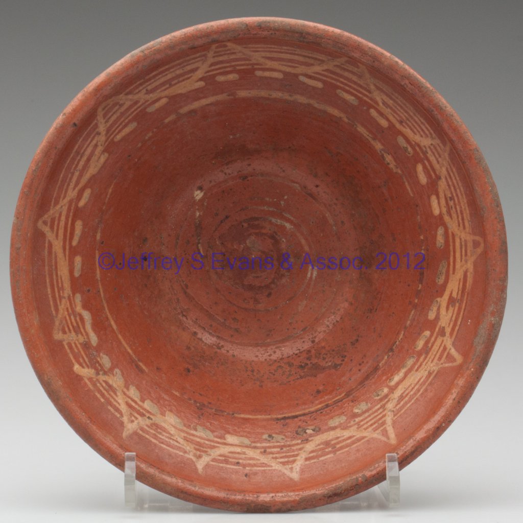 SLIP-DECORATED EARTHENWARE BOWL: SLIP-DECORATED EARTHENWARE BOWL, lead glazed interior with glaze running over onto exterior, deep form with upright rim, yellow-slip swag, ring and dash decoration. 19th century. 3 1/4" H, 8 3/4" D. P