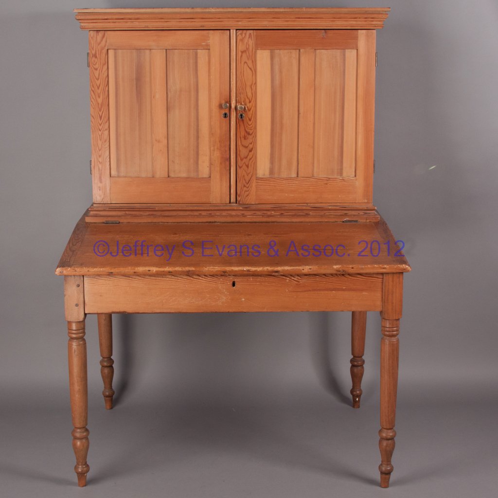 VIRGINIA YELLOW PINE PLANTATION DESK: VIRGINIA YELLOW PINE PLANTATION DESK, in two sections, the top with two hinged split-panel doors concealing an interior fitted with cubby holes, ledger slides and a single drawer, base with a hinged l
