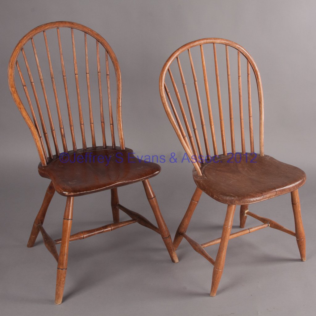 AMERICAN WINDSOR SIDE CHAIRS, LOT OF TWO: AMERICAN WINDSOR SIDE CHAIRS, LOT OF TWO, each bow-back with nine spindles above a shaped seat raised on bamboo-turned legs. Late 18th/early 19th century. 37" and 35" HOA. Provenance: The collection o