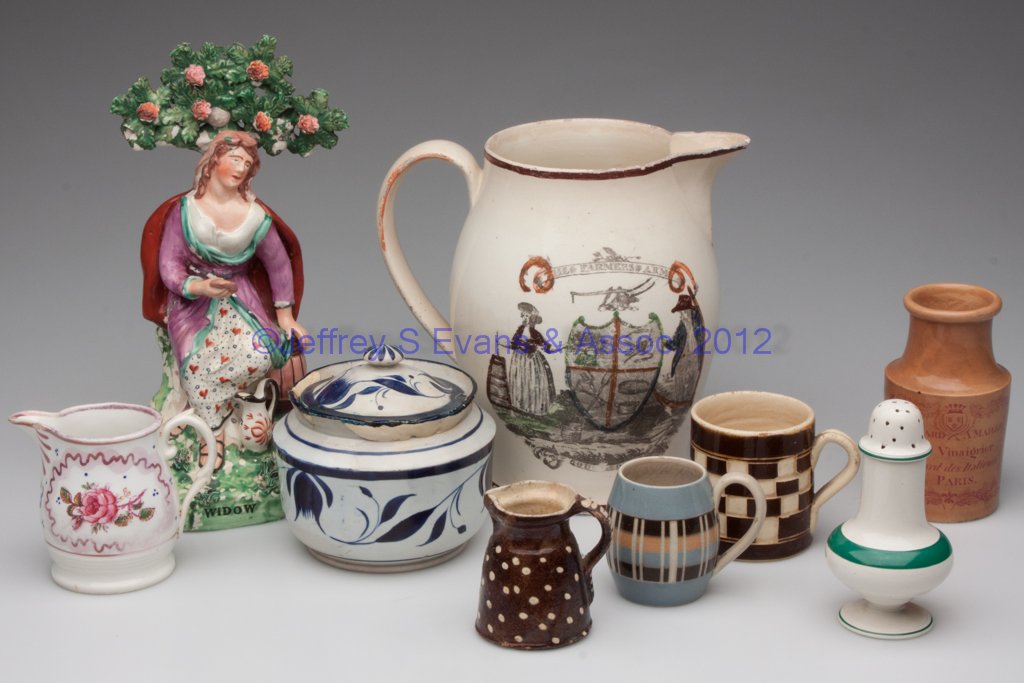 ASSORTED DECORATED CERAMIC ARTICLES, LOT OF NINE: ASSORTED DECORATED CERAMIC ARTICLES, LOT OF NINE, including a Staffordshire "Widow" figure, and a "Farmers Arms / Farm Yard" transfer-decorated jug. England and others. 19th century. 2 1/2" to 10 1/4"