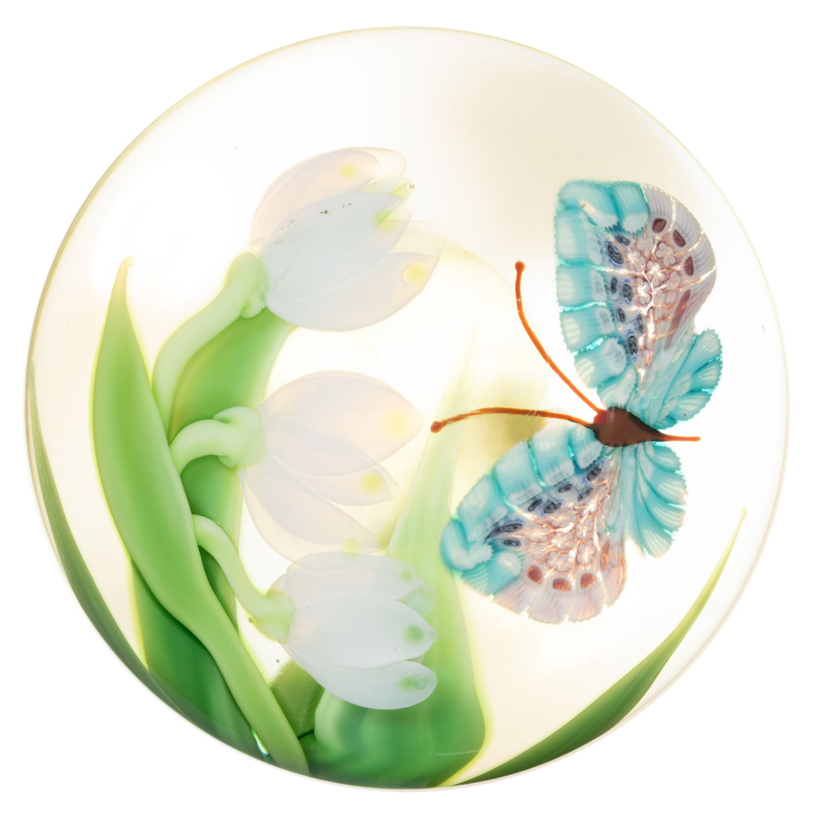 BRUCE SILLARS (AMERICAN, B. 1951) BUTTERFLY AND FLOWERS LAMPWORK STUDIO ART GLASS PAPERWEIGHT: BRUCE SILLARS (AMERICAN, B. 1951) BUTTERFLY AND FLOWERS LAMPWORK STUDIO ART GLASS PAPERWEIGHT, brown butterfly with blue, white, and lavender millefiori wings flying towards three blooming white flowe