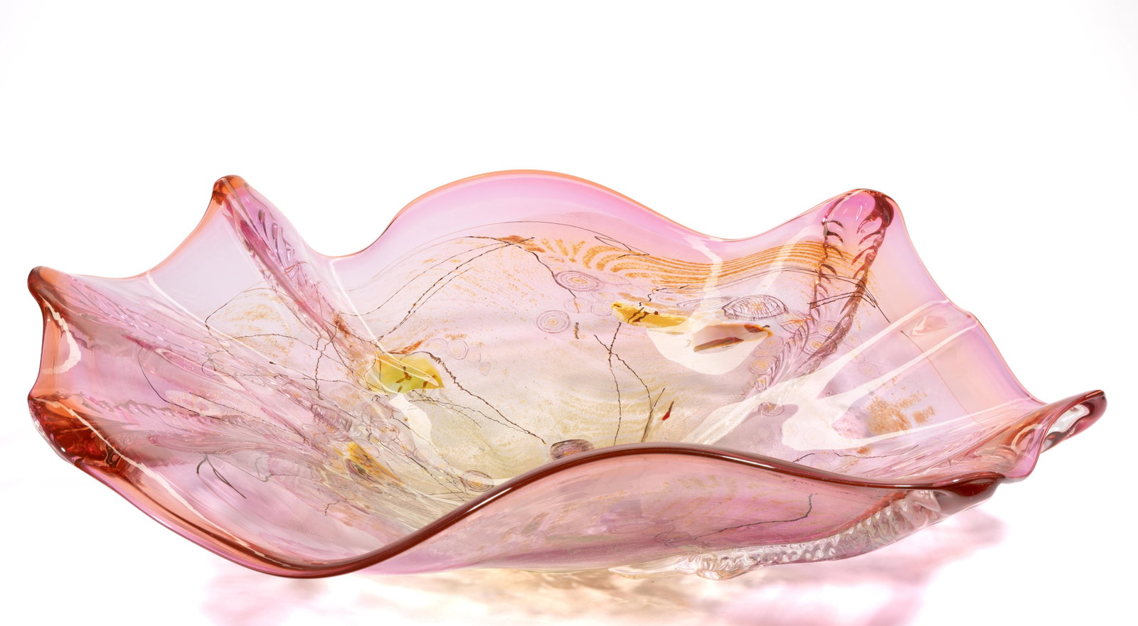 ILLEGIBLY SIGNED MILLEFIORI STUDIO ART GLASS CENTERPIECE BOWL: ILLEGIBLY SIGNED MILLEFIORI STUDIO ART GLASS CENTERPIECE BOWL, shaded cranberry, large abstract bowl featuring a variety of millefiori canes and plaques, exterior having six colorless applied feather 