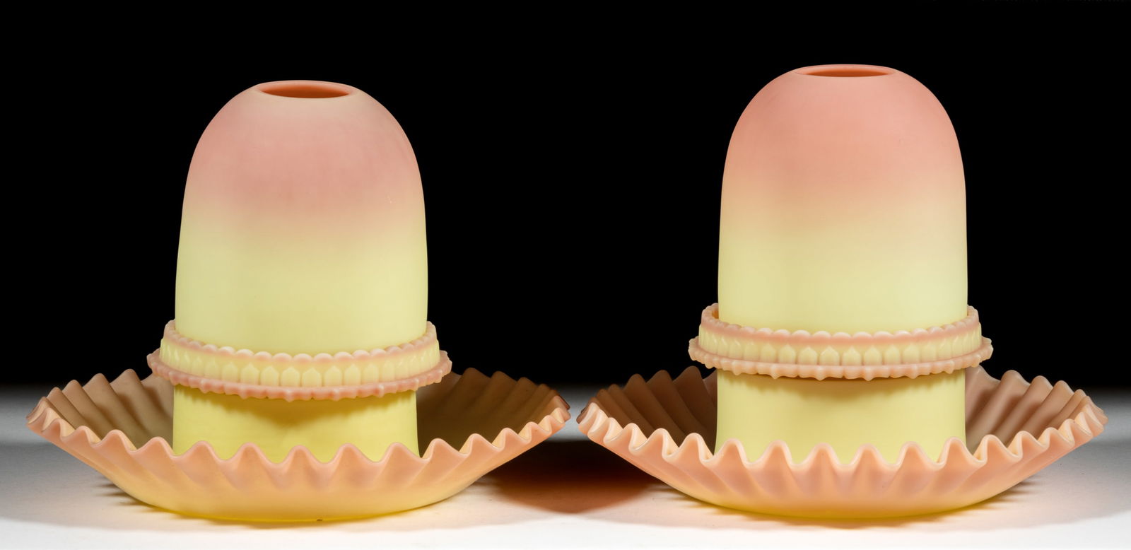 THOMAS WEBB BURMESE FAIRY LAMPS, PAIR: THOMAS WEBB BURMESE FAIRY LAMPS, PAIR, plush finish, fairy-size domes, three-part construction comprising each dome fitted on a Burmese S. Clarke ribbed patterned candle lamp base