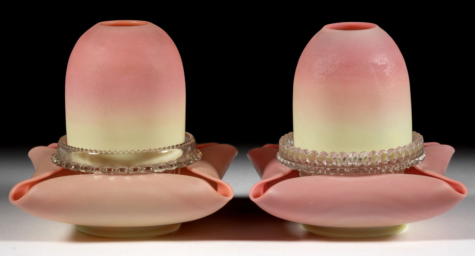 THOMAS WEBB BURMESE GLASS FAIRY LAMPS, PAIR: THOMAS WEBB BURMESE GLASS FAIRY LAMPS, PAIR, plush finish, fairy-size domes, each with three-part construction comprising the dome fitted on non-matching colorless Clarke's ribbed p