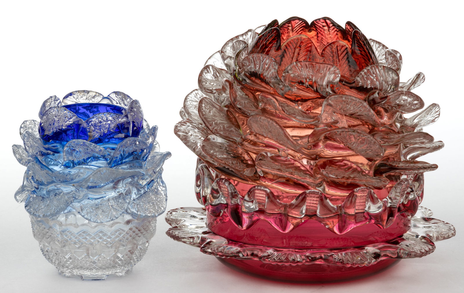 FLORIFORM FAIRY LAMPS, LOT OF TWO: FLORIFORM FAIRY LAMPS, LOT OF TWO, comprising a shaded blue and colorless pyramid-size dome with four rows of applied petals/leaves fitted in a colorless Clark's candle lamp base, and a cranb
