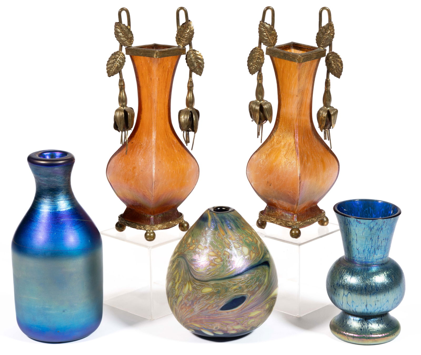 ASSORTED IRIDESCENT ART GLASS VASES, LOT OF FIVE: ASSORTED IRIDESCENT ART GLASS VASES, LOT OF FIVE, including a blue iridescent Loetz Papillon, a mottled studio art glass ovoid, and a pair of diminutive amber mantle vases with metal overlay. Various