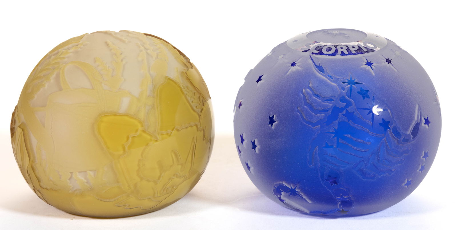 KELSEY MURPHY SAND-CARVED CAMEO ART GLASS PAPERWEIGHTS, LOT OF TWO: KELSEY MURPHY SAND-CARVED CAMEO ART GLASS PAPERWEIGHTS, LOT OF TWO, comprising a yellow to custard "Kitty Garden" featuring a cat cleaning its paw/face sitting in a flower garden, and a case