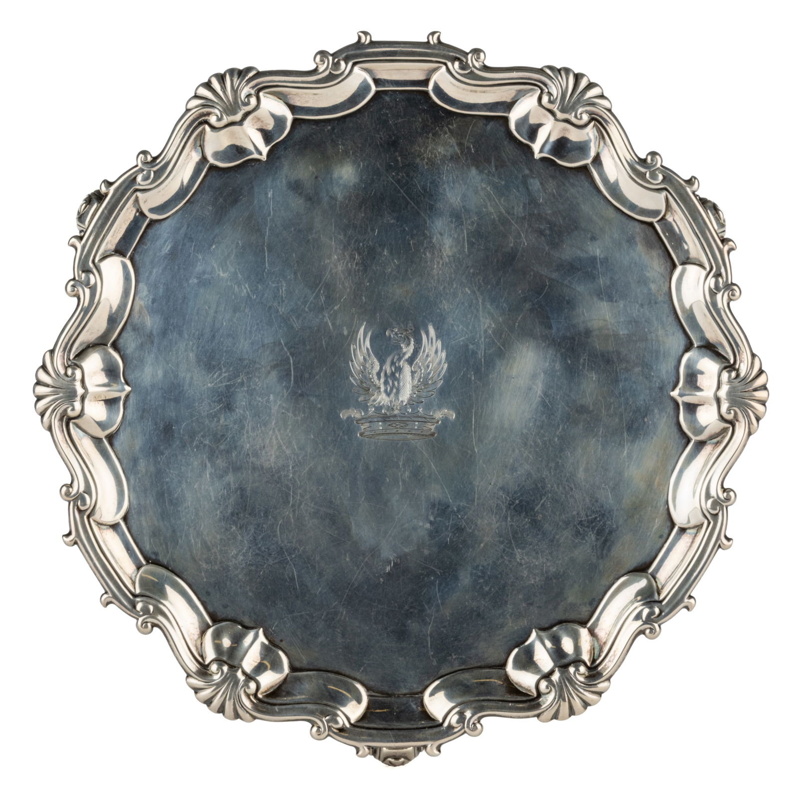 JOHN HARVEY I, ENGLISH GEORGE II STERLING SILVER SALVER: JOHN HARVEY I, ENGLISH GEORGE II STERLING SILVER SALVER, having a round well with a scroll-and-shell rim, center with later engraved heraldry-type decoration featuring a demi-eagle or demi-phoeni