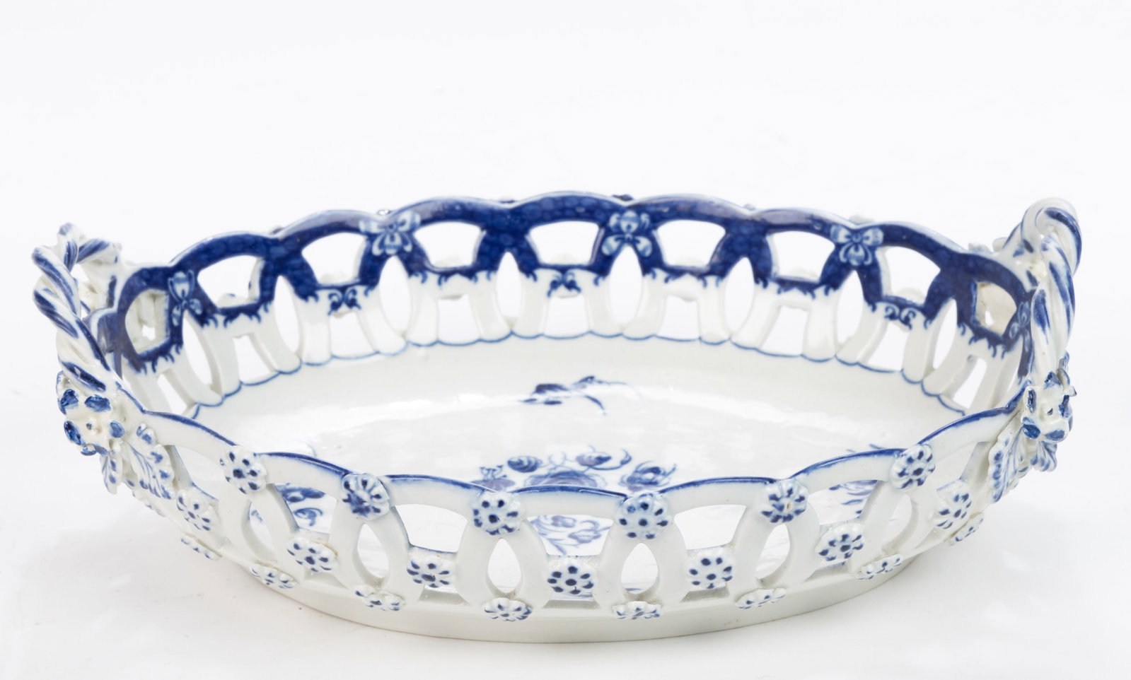 ENGLISH CAUGHLEY PORCELAIN RETICULATED BASKET: ENGLISH CAUGHLEY PORCELAIN RETICULATED BASKET, featuring blue hand-painted and printed floral motif with applied flowers to exterior and raised twisted handles. Having crescent moon mark to 