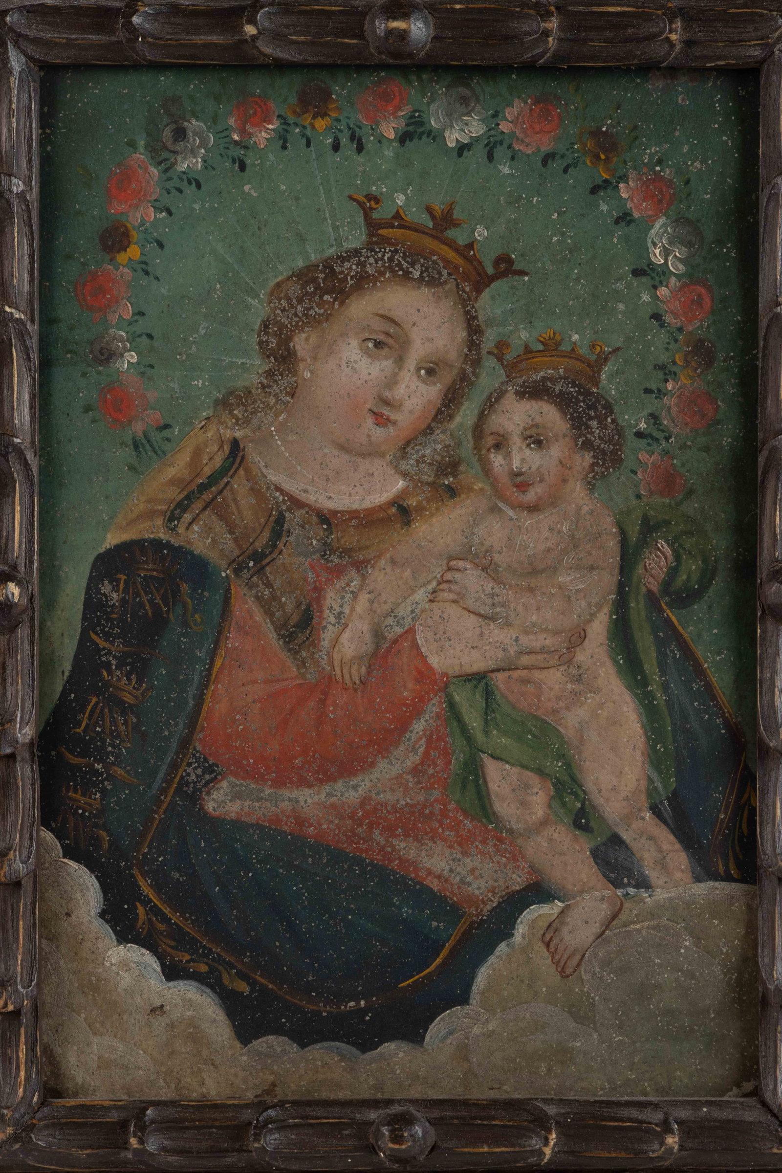 SOUTH AMERICAN / MEXICAN OUR LADY OF REFUGE RETABLO: SOUTH AMERICAN / MEXICAN OUR LADY OF REFUGE RETABLO, oil on sheet-iron or tin, featuring the typical depiction of the Virgin Mary and the Christ child above a cloud-like base. A small tag remnant vers