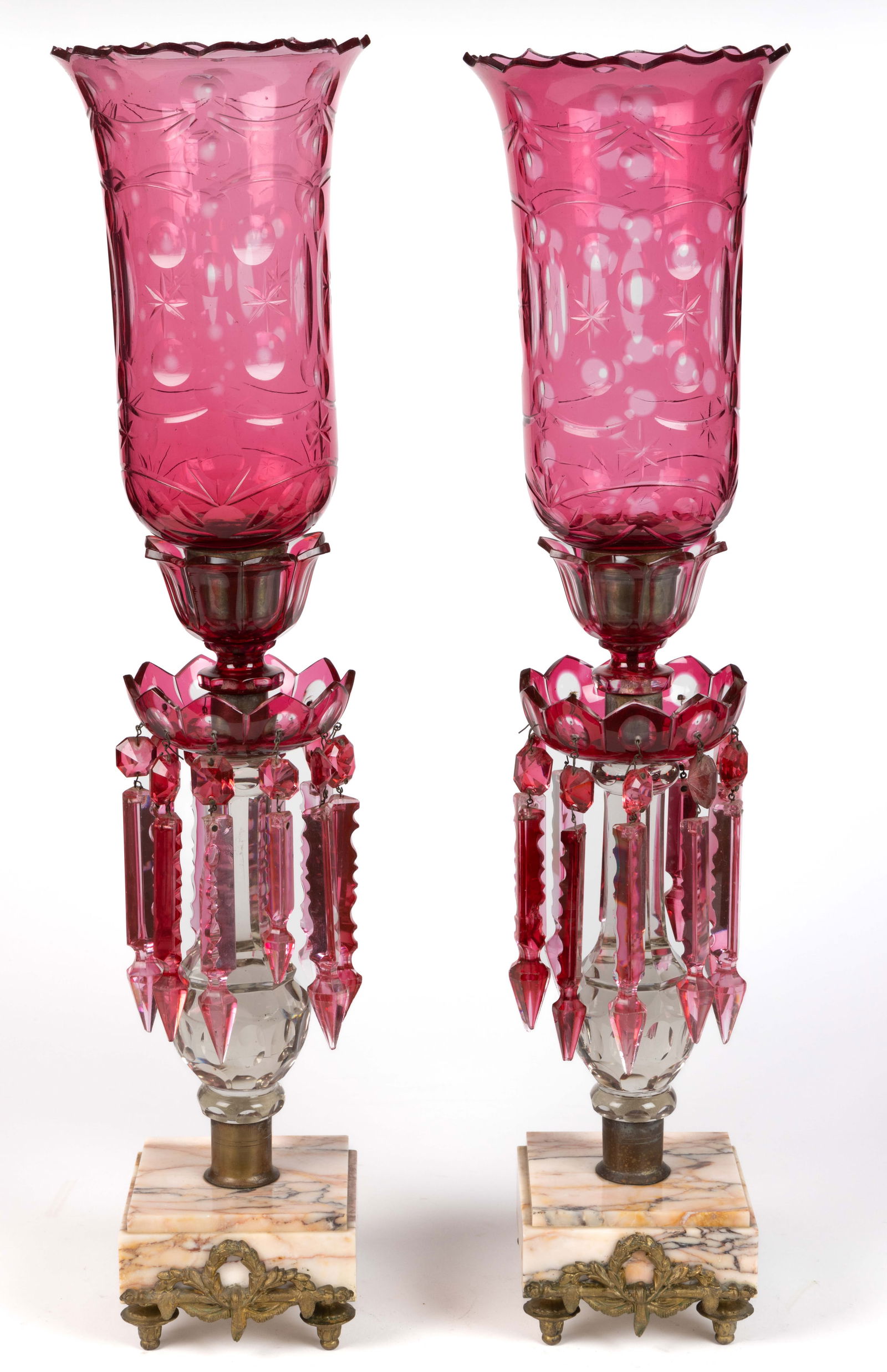 PAIR OF EUROPEAN CUT OVERLAY MANTLE LUSTERS WITH HURRICANE SHADES: PAIR OF EUROPEAN CUT OVERLAY MANTLE LUSTERS WITH HURRICANE SHADES, cranberry to colorless, constructed of several sections comprising a square stepped marble base with four applied metal feet and a gi