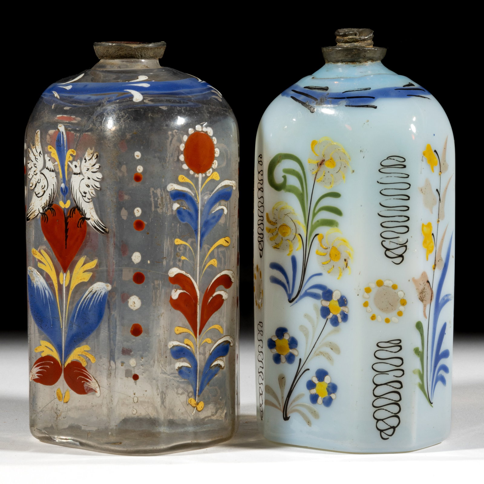 HALF-POST BLOWN AND DECORATED "STIEGEL-TYPE" BOTTLES / FLASKS, LOT OF TWO: HALF-POST BLOWN AND DECORATED "STIEGEL-TYPE" BOTTLES / FLASKS, LOT OF TWO, colorless and fiery opalescent, half-post method, typical flattened octagonal form with beveled corners, 