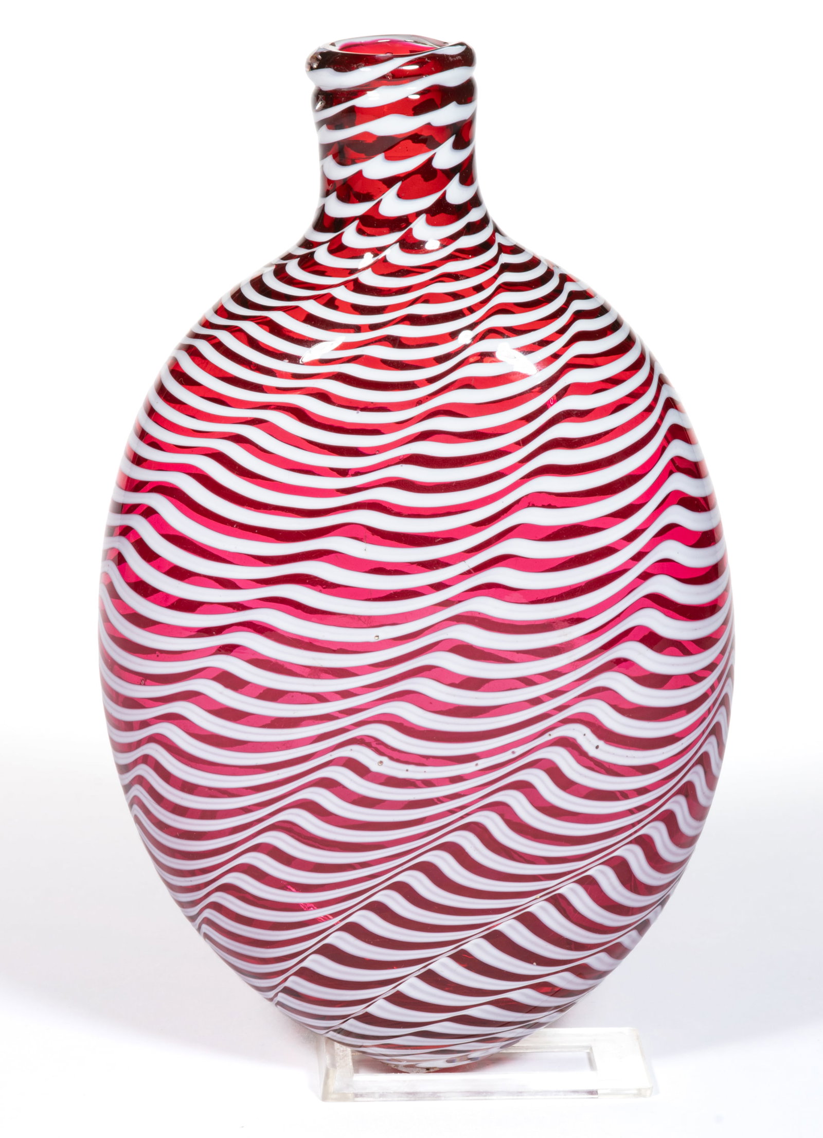 FREE-BLOWN AND WAVE DECORATED GLASS FLASK: FREE-BLOWN AND WAVE DECORATED GLASS FLASK, cranberry with opal decoration, large ovoid body with tightly twisting opal threads, polished pontil mark. United States or England. Second half 19th century