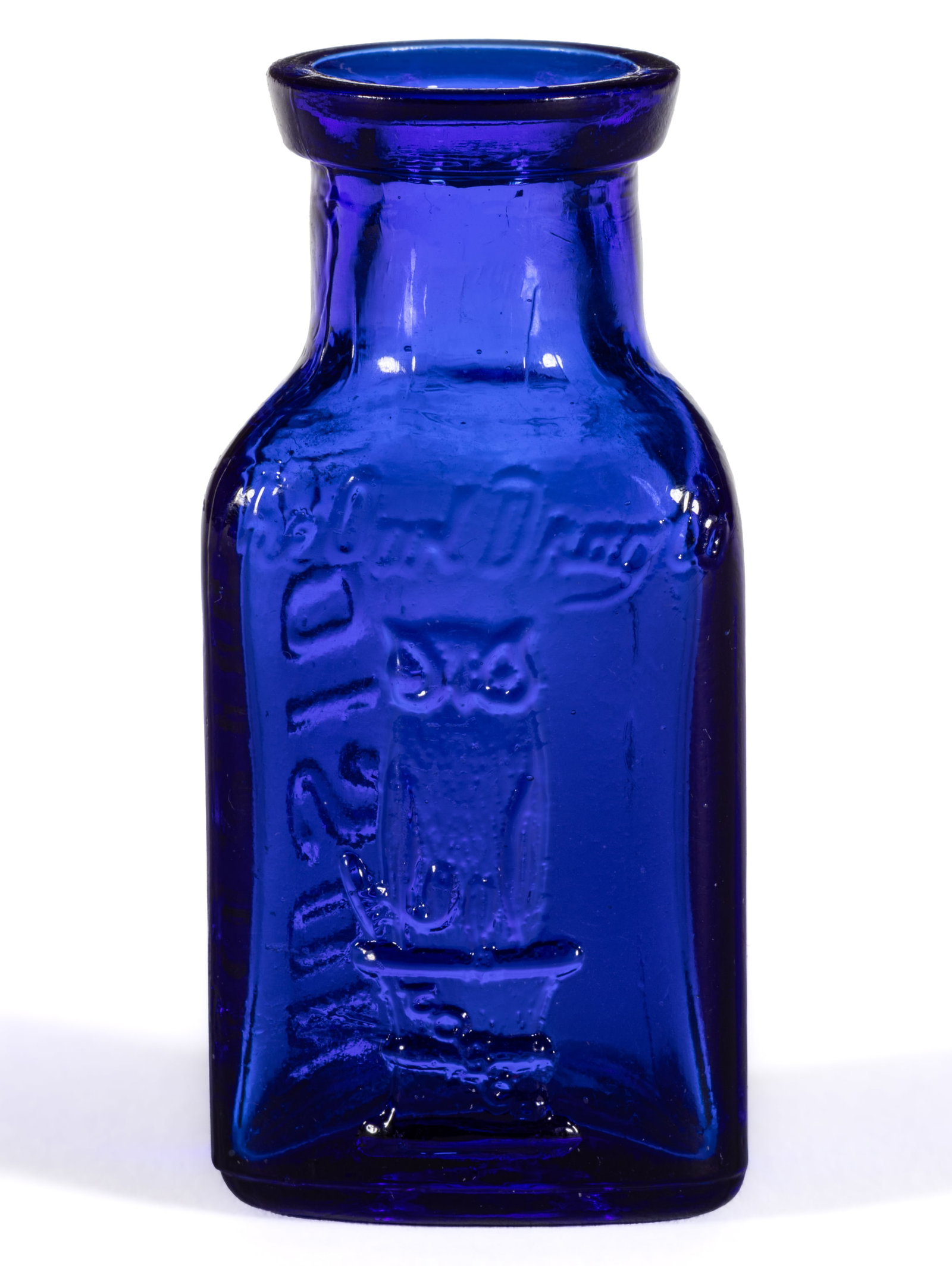 SMALL-SIZED OWL DRUG CO. TRIANGULAR KT-1 POISON BOTTLE: SMALL-SIZED OWL DRUG CO. TRIANGULAR KT-1 POISON BOTTLE, cobalt blue, triangular shape, one panel embossed with front-facing two-wing owl on a mortar and pestle having "T O D CO" monogra