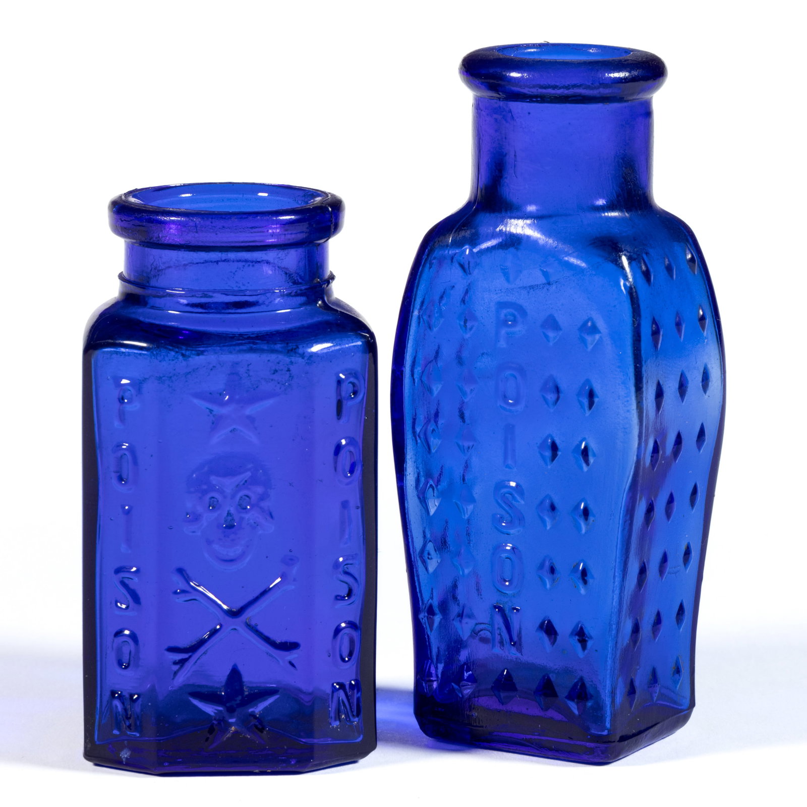 ASSORTED POISON BOTTLES, LOT OF TWO: ASSORTED POISON BOTTLES, LOT OF TWO, cobalt blue, comprising a KU-19 round-backed bottle embossed twice with "POISON" and a pictorial so-called "laughing" skull and crossbones, and