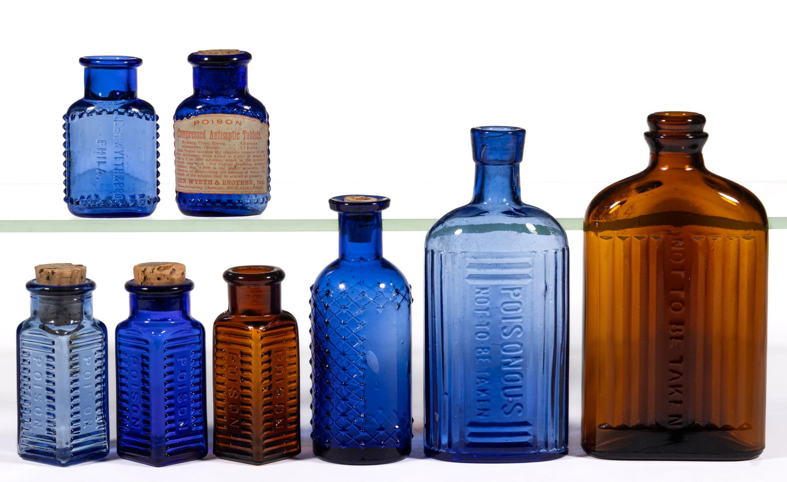 ASSORTED POISON BOTTLES, LOT OF EIGHT: ASSORTED POISON BOTTLES, LOT OF EIGHT, various colors and forms including a trio of square KS-2's in cobalt, amber, and cornflower blue; a cylindrical diamond-lattice KC-1; and two KO-45 vari