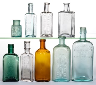 ASSORTED EMBOSSED PATENT MEDICINE / APOTHECARY BOTTLES, LOT OF NINE