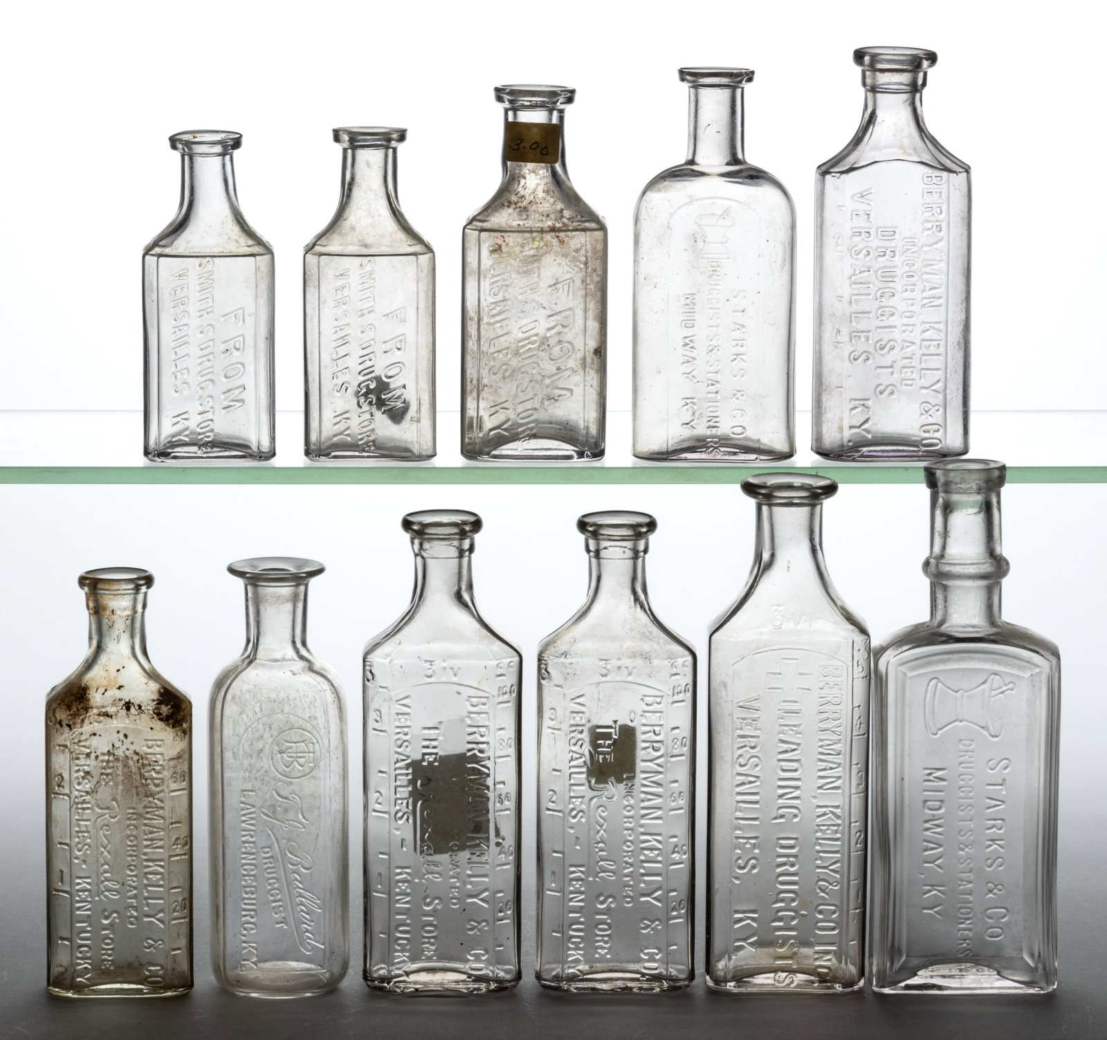 KENTUCKY EMBOSSED MEDICINE / PHARMACY BOTTLES, LOT OF 11: KENTUCKY EMBOSSED MEDICINE / PHARMACY BOTTLES, LOT OF 11, an assortment of colorless rectangular slug plate-embossed prescription bottles from primarily the Lexington area including mainly variants of