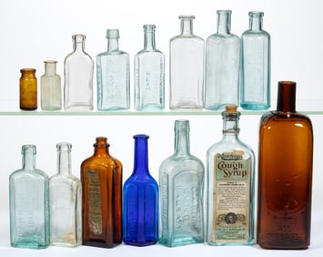 ASSORTED EMBOSSED PATENT MEDICINE / APOTHECARY BOTTLES, LOT OF 15