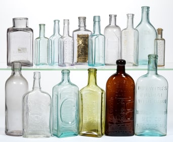 ASSORTED EMBOSSED PATENT MEDICINE / APOTHECARY BOTTLES, LOT OF 16