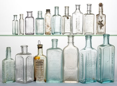 ASSORTED EMBOSSED PATENT MEDICINE / APOTHECARY BOTTLES, LOT OF 17