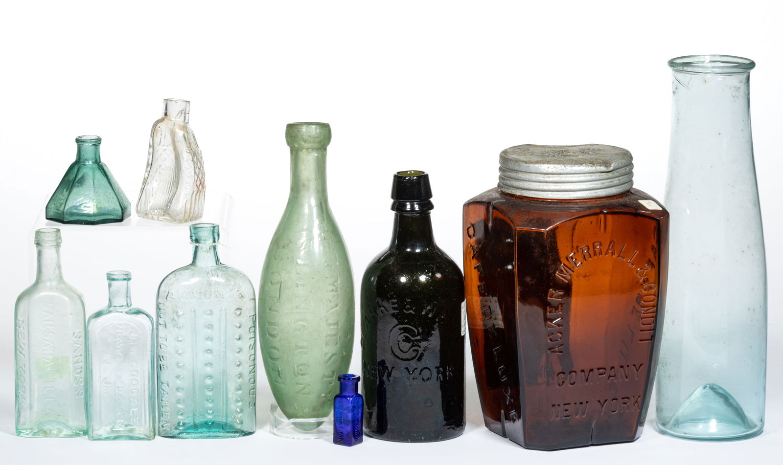 ASSORTED ANTIQUE GLASS BOTTLES, LOT OF TEN: ASSORTED ANTIQUE GLASS BOTTLES, LOT OF TEN, various colors and shapes/sizes, including a pale teal green umbrella ink, a rectangular paneled medicine/druggist bottle embossed "J.A. GOODALE / NEWT